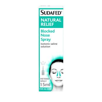 The image shows a Sudafed Natural Relief Blocked Nose Spray (15ml) box. The white and teal design emphasizes its isotonic saline solution for congestion relief, with a metered spray ideal for all ages. An illustration depicts a person easing nasal congestion.