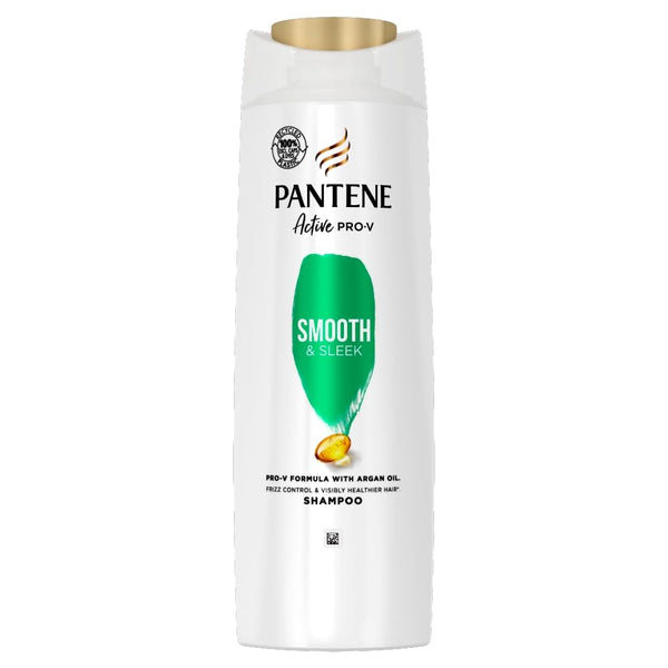 A white bottle of Pantene Pro-v Smooth & Sleek Shampoo (500ml) features a Pro-V Nutrients and argan oil formula. With green text on the label and a gold cap, it promises frizz control and a sleek finish.