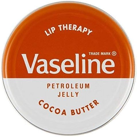 The Vaseline Lip Therapy Cocoa Butter (20g) tin offers lip hydration, with an orange top featuring the Vaseline logo and a white bottom labeled Petroleum Jelly and Cocoa Butter.