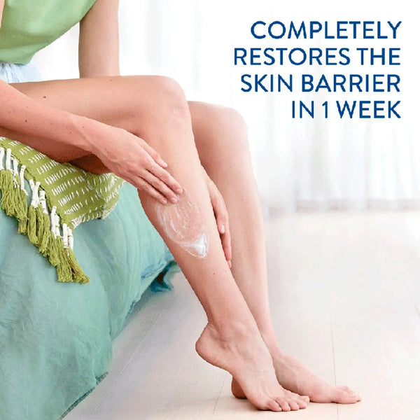 A person sits on a bed applying Cetaphil Moisturising Cream (450g) to their leg. A green blanket with tassels adds coziness. Text reads, Restores skin barrier in 1 week, offers 48-hour hydration for dry, sensitive skin, emphasizing the effectiveness of Cetaphil.