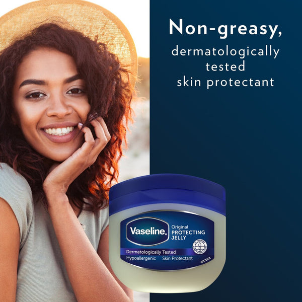 A smiling woman in a straw hat poses outdoors next to a 50ml jar of Vaseline Petroleum Jelly. Labeled Original Protecting Jelly, this dermatologically tested product is triple-purified and non-greasy, providing effective skin protection.