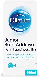 Box of Oilatum Junior Bath Emollient Additive (150ml) with a blue swirl logo. Text includes: light liquid paraffin, soothing bath treatment for eczema relief and dry skin conditions. A small blue fish illustration is at the bottom.