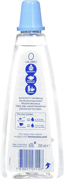 This 200ml Hermesetas Liquid sweetener bottle, an ideal sugar substitute, features a blue cap. The label promotes zero calories and includes icons for drinks, desserts, and cooking. Made in Switzerland with a visible barcode.