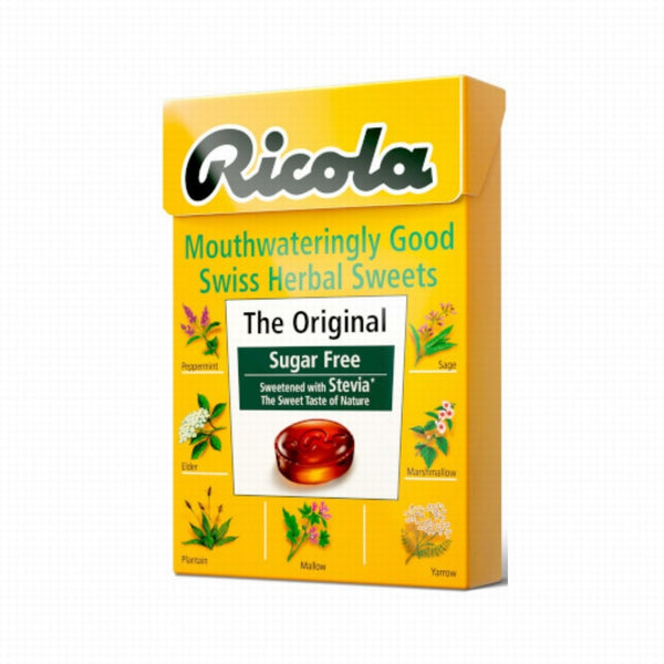 A yellow box of Ricola Swiss Herbal Sweets Sugar-Free Original (45g) shows herbs like peppermint, sage, elder, and yarrow. The label notes “Sugar Free,” “Sweetened with Stevia,” and supports natural throat comfort.