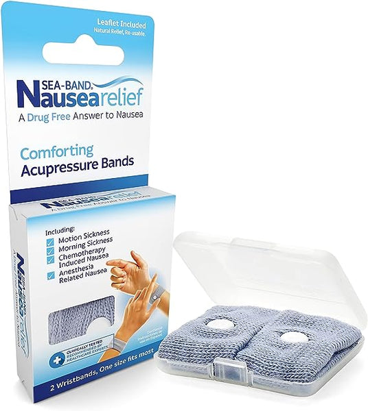A box labeled Sea-Band for Adults (1 Pair) by Sea-Band sits beside an open case displaying two gray knitted acupressure wristbands. The packaging promotes this drug-free solution for motion and morning sickness with illustrated instructions.