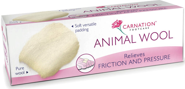 A white box of Carnation Animal Wool - (25g) showcases a wool image on the left, highlighting its use as soft, versatile padding to relieve shoe friction and pressure. The phrase Pure wool appears near the wool image, guaranteeing excellent foot relief.