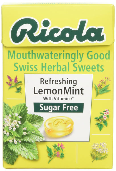 A yellow 45g box of Ricola Swiss Herbal Sweets Sugar-Free Lemon Mint features images of mint and lemon balm leaves, the label Mouthwateringly Good with Vitamin C, from Ricolas famous sugar-free range.