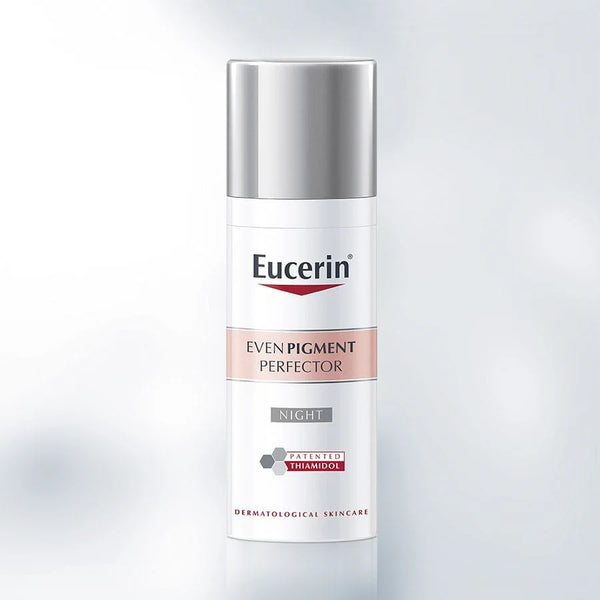 Eucerin Anti-Pigment Night Cream (50ml) by Eucerin, with its silver cap, white body, and pink label, is shown against a light background. This cream helps reduce dark spots and even skin tone for a more radiant look.