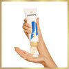 A person dispenses Pantene Active Pro-V Classic Clean Conditioner (275ml) onto their palm from a tube, with both hands visible against a plain white background.