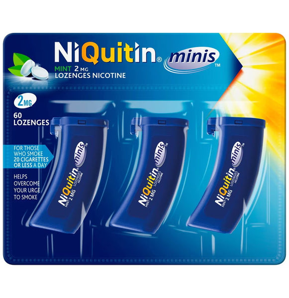 The image displays a pack of NiQuitin Minis Mint-2mg Lozenges (60s), featuring three containers in blue packaging. It serves as Nicotine Replacement Therapy for individuals who smoke 20 or fewer cigarettes daily, providing mint-flavored lozenges to help quit smoking.