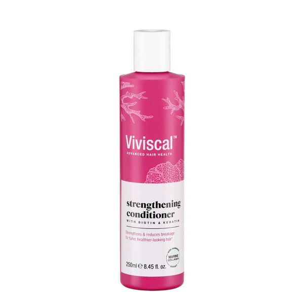 A 250ml pink bottle of Viviscal Hair Strengthening Conditioner features biotin and keratin to reduce breakage and boost hair thickness, promoting healthier-looking hair with white text and floral graphics.