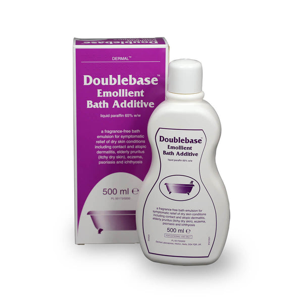 A 500ml bottle of Doublebase Emollient Bath Additive by Doublebase is shown beside its box. Both are white with purple accents and display information for effective dry skin and eczema treatment.