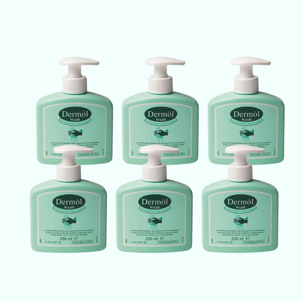 Six bottles of Dermol Wash Six Pack X6 (200ml) by Dermol, featuring white pump dispensers and green labels, are arranged in two rows of three against a light background.