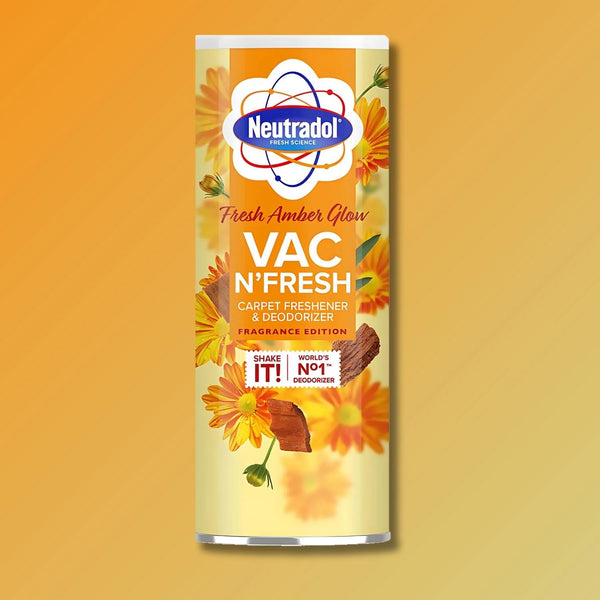 Neutradol Vac Scents Fresh Amber Glow Carpet Deodorizer (350g), by Neutradol, comes in a cylindrical container with yellow flowers and a yellow-orange gradient background.