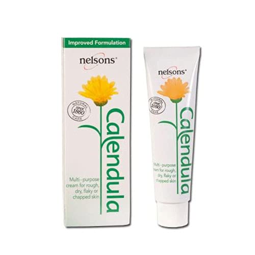 A 50ml tube of Nelsons Calendula Cream is shown with its box, featuring a yellow flower and green text on a white backdrop. Ideal for dry, flaky, or chapped skin, the cream has an enhanced formula with marigold extracts.