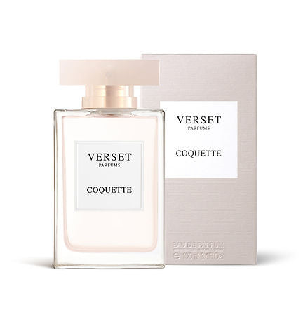 A clear bottle of Verset Coquette (100ml) by Verset, with hints of peony and white musk, stands elegantly before its matching light-colored box. The translucent rectangular cap and label highlight the brand and fragrance name, reflecting the floral allure.