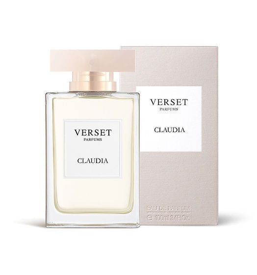 A Verset Claudia (100ml) fragrance bottle, with a clear glass and frosted cap, offers enticing notes of jasmine and vanilla. It sits next to a beige and white box with a minimalist design labeled Verset Parfums Claudia, embodying Oriental Floral elegance.