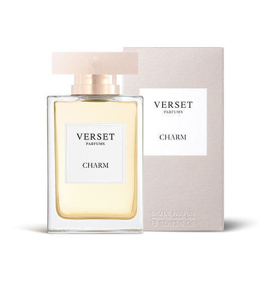 A bottle of Verset Charm (100ml) by Verset is showcased with its matching box. The transparent bottle, adorned with a beige cap and white label featuring black text, radiates a Floral Oriental allure, while the box replicates this elegance through its beige branding.