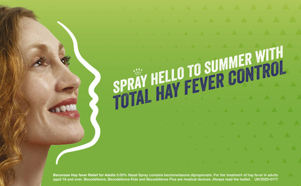 A smiling woman faces a white face outline on green. Large text: Spray hello to summer with total allergy relief. Below, small print shares Beconase Allergy Defence (120 sprays) medication info for allergic rhinitis and nasal spray use. Brand: Beconase.