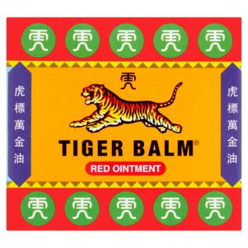 The image shows a square package of Tiger Balm Red Ointment (19g) from Tiger Balm. A central tiger illustration on an orange background, with green circles and white Asian characters along the border, emphasizes its esteemed herbal formula for muscle relief.