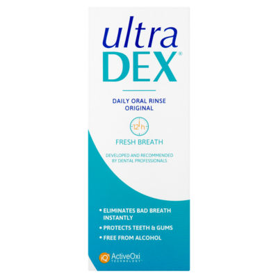 Front view of an UltraDex Daily Oral Rins box, showing text about its 12-hour fresh breath, elimination of bad breath, gum and teeth protection, whitening support, and alcohol-free formula.