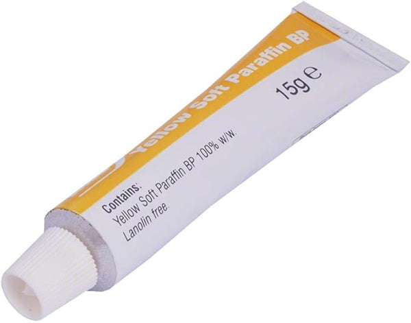 A 15g tube of Ecolabs Yellow Soft Paraffin BP, labeled lanolin-free for skin protection, is predominantly white with a yellow area near the cap and black text.