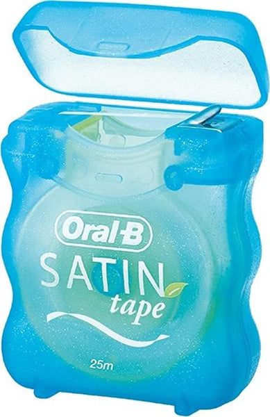 A blue translucent container with the lid open reveals refreshing minty Oral-B Satin Tape dental floss from Oral B. The label shows its 25 meters long, and the floss is slightly visible inside, ready for use.