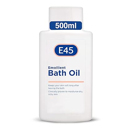 The white 500ml bottle of E45 Emollient Bath Oil, topped with a blue cap, offers a clinically proven, perfume-free formula that moisturizes and softens dry, itchy skin even in challenging conditions.