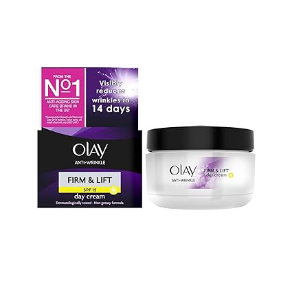 Image of Olay Anti-Wrinkle Firm & Lift Day Cream (50ml) with SPF 15, promising visible wrinkle reduction in 14 days due to niacinamide. The cream is in a white jar with a black lid, while the box boasts striking black and purple colors.