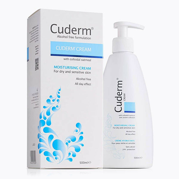 A white Cuderm Lotion Oatmeal (500ml) bottle with a pump dispenser sits beside its box, both featuring blue swirl designs. The packaging highlights it as an alcohol-free moisturizer for dry, sensitive skin, enriched with colloidal oatmeal.