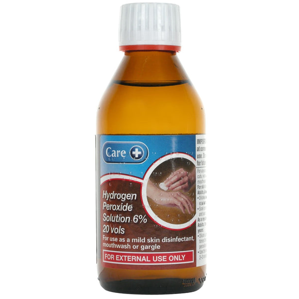 A brown bottle with a white cap labeled Care Hydrogen Peroxide 6% (20 Vols) displays an image of disinfected hands. Its ideal for external use only, making it perfect for wound cleaning.