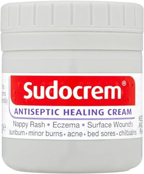 The 60g Sudocrem Antiseptic Healing Cream features a red and white label showcasing its benefits for nappy rash, eczema, minor burns, acne, sunburns, surface wounds, bed sores, and chilblains. This skincare essential offers soothing relief while aiding recovery.