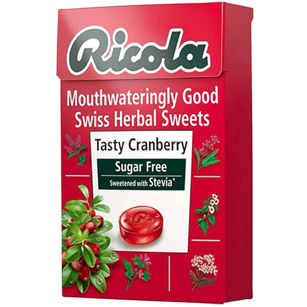 Ricola Swiss Herb Drops Sugar-Free Cranberry Box (45g) features a distinctive red design with cranberry and herb imagery, delivering the delightful taste of Tasty Cranberry. Sweetened with stevia, its a guilt-free treat from Ricola.