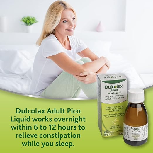 A smiling woman sits on a bed in a white room. In front of her are a box and bottle of Dulcolax Adult Pico Liquid 5mg/5ml Oral Solution (100ml). It features bisacodyl for effective constipation relief with an overnight action, providing gentle, dependable results within 6 to 12 hours.