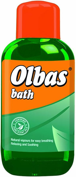 A 250ml green plastic bottle with a red cap labeled Olbas Oil Bath Liquid by Olbas, featuring an orange and green label with a leaf design and text highlighting natural oils for easy nasal breathing, described as relaxing and soothing.