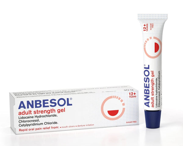 The Anbesol Adult Strength Gel (10g), in a white tube labeled with Lidocaine, is next to its box with a red circular design. It offers effective oral pain relief for mouth ulcers and is recommended for ages 12 and up.