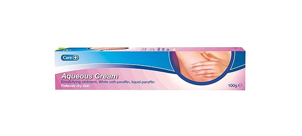 A 100g rectangular box of Care brand Aqueous Cream features pink and blue packaging with a hand image. This emulsifying ointment, enriched with menthol, alleviates dry skin irritation.