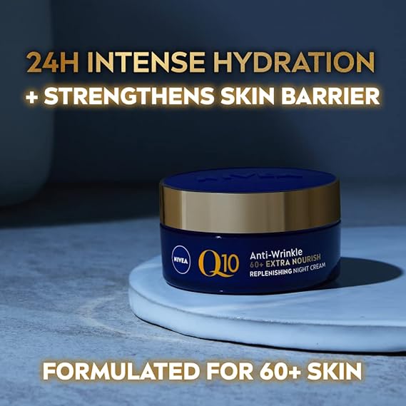 A jar of Nivea Visage Q10 Power 60+ Night Cream (50ml) sits on a blue surface, featuring text like 24H Intense Hydration, Strengthens Skin Barrier, and Formulated for 60+ Skin.