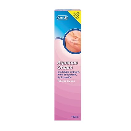 The image features a 100g box of Care Aqueous Cream by Care, designed with pink and white packaging. Its adorned with the brand logo, product description, and shows a hand applying cream. The cream includes emollients for relieving dry skin and soothing irritation.