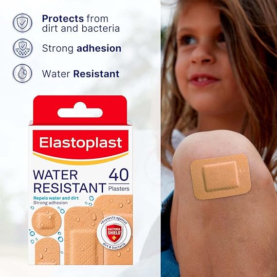 A young girl with flowing hair sits peacefully, a beige plaster on her knee. Beside her, a box of Elastoplast Water Resistant 40 Plasters promises protection against dirt and bacteria—a perfect addition to any first-aid kit for strong adhesion and water resistance.