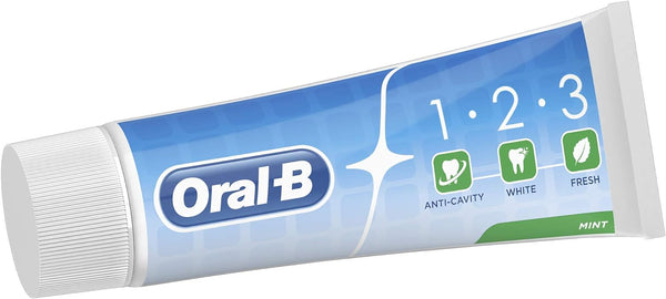 A blue tube of Oral-B 123 Toothpaste 100ML, featuring a white cap and marked with icons/text promoting its anti-cavity and whitening benefits. The word mint promises fresh breath and is situated in the bottom right corner.