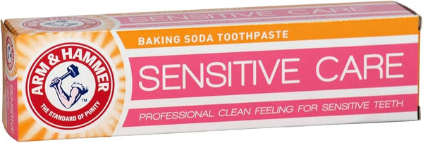 A 125g box of Arm and Hammer Sensitive Toothpaste features pink, orange, and white packaging with the brand logo and text promoting cavity protection and a professional clean feeling for sensitive teeth.