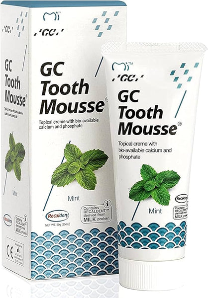 The GC Tooth Mousse Mint Blue (40g) box and tube show mint leaves and blue waves, emphasizing Recaldents role in enamel restoration and sensitivity reduction with bio-available calcium and phosphate from milk protein.