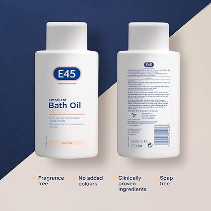 Two 500ml bottles of E45 Emollient Bath Oil are shown, ideal for dry skin. One bottle displays the front label and the other, the back. This product from E45 is perfume-free, features clinically proven ingredients, and contains no added colors or soap.