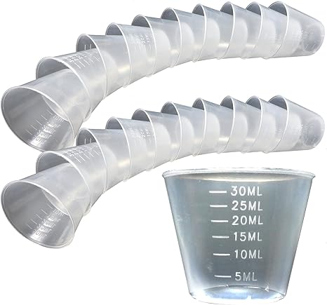A row of Generic Plastic Reusable Guided Measuring Cup Tablet Containers (30ml) features translucent cups showing measurements from 5ml to 30ml. One cup is enlarged in the foreground, highlighting its precision. Perfect for pharmaceutical storage, they are set diagonally on a white background.