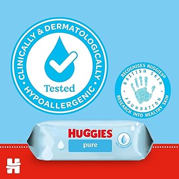 A pack of Huggies Baby Wipes Pure 0% Plastic (48 Pack) is displayed, featuring icons for dermatologically tested, hypoallergenic certification, and British Skin Foundation recognition, emphasizing their gentle formula made with pure water for sensitive skin.