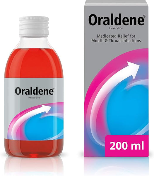 The image shows a 200ml Oraldene Medicated Antibacounterial mouthwash bottle with red liquid, featuring the brand name. The box’s blue and pink design highlights its Hexetidine formula for medicated relief of mouth ulcers and throat infections.