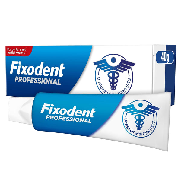 The Fixodent Professional Denture Adhesive Cream, designed with dentists, comes in a 40g tube and packaging featuring a tooth and caduceus logo on a blue label. It ensures an odor-free hold, combats gum irritation, and provides a secure fit against bacteria growth.