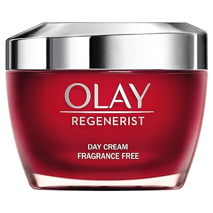 The Olay Regenerist Daily 3 Point Treatment Cream (Oilatum) comes in a stylish red jar with a silver lid and Fragrance Free label, offering an elegant and effective skincare solution.