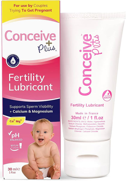 The image shows a Conceive Plus Fertility Lubricant Tube (75ml) and box, serving as a conception aid. The yellow-and-pink box features a baby and highlights product benefits, while the white-and-pink tube is labeled Fertility Lubricant with detailed information.